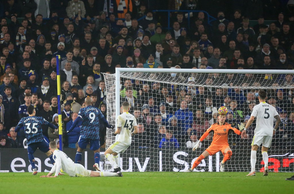 Arsenalu00e2u20acu2122s Brazilian striker Gabriel Martinelli (left) scores his teamu00e2u20acu2122s first goal during the Premier League match between against Leeds United at Elland Road in Leeds, England on December 18, 2021. u00e2u20acu201d AFP pic