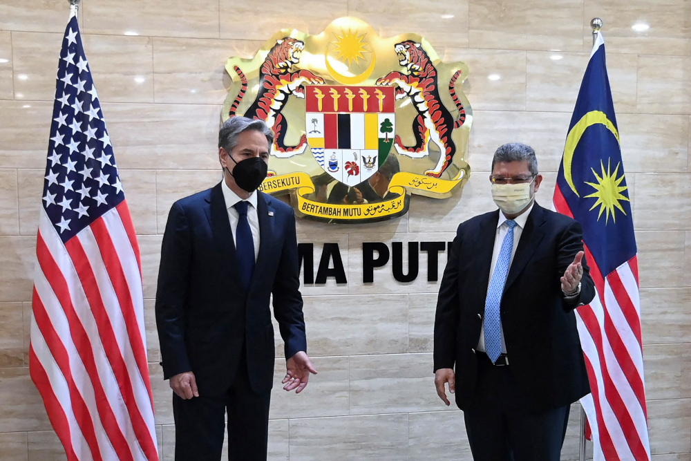 Malaysian Foreign Minister Datuk Seri Saifuddin Abdullah welcomes US Secretary of State Antony Blinken upon his arrival at the Foreign Ministry in Putrajaya, Malaysia, December 15 , 2021. u00e2u20acu201d Foreign Ministry handout pic via Reuters 