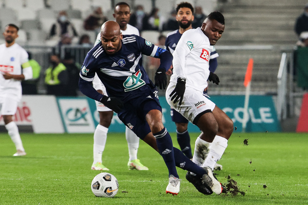 Bordeaux forward Jimmy Briand fights for the ball during the French Cup round-of-64 football match between FC Girondins de Bordeaux and AS Jumeaux de Mzouazia at the Matmut Atlantique stadium in Bordeaux, France, December 19, 2021. u00e2u20acu201d AFP pic 