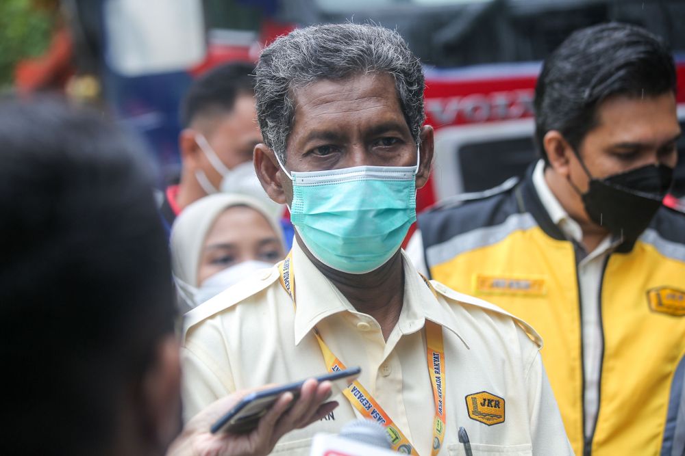 Perak Public Works Department deputy director Hamdan Ali speaks to reporters near the site of the landslide along Jalan Simpang Pulai December 3, 2021. u00e2u20acu201d Picture by Farhan Najib