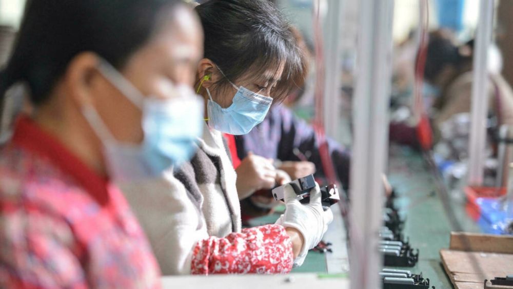 Assembly-line workers at a factory in Fuyang in eastern China. u00e2u20acu201d AFP file pic