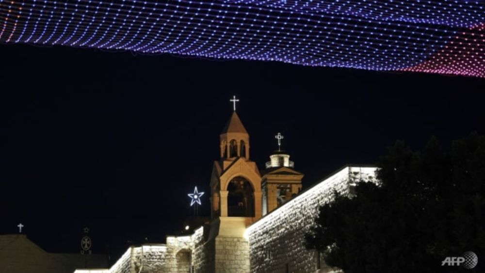 Lights bedeck the Church of the Nativity in Bethlehem on Christmas Eve 2021, its second year under the shadow of the pandemic. u00e2u20acu201d AFP pic