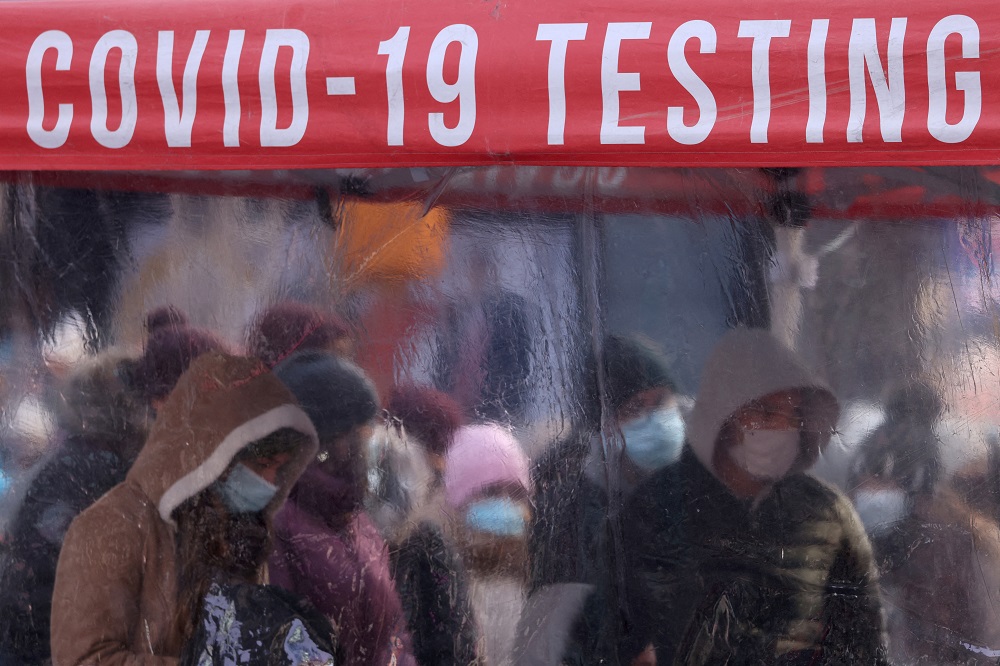 People queue to be tested for Covid-19 in Times Square, as the Omicron coronavirus variant continues to spread in Manhattan, New York December 20, 2021. u00e2u20acu2022 Reuters pic