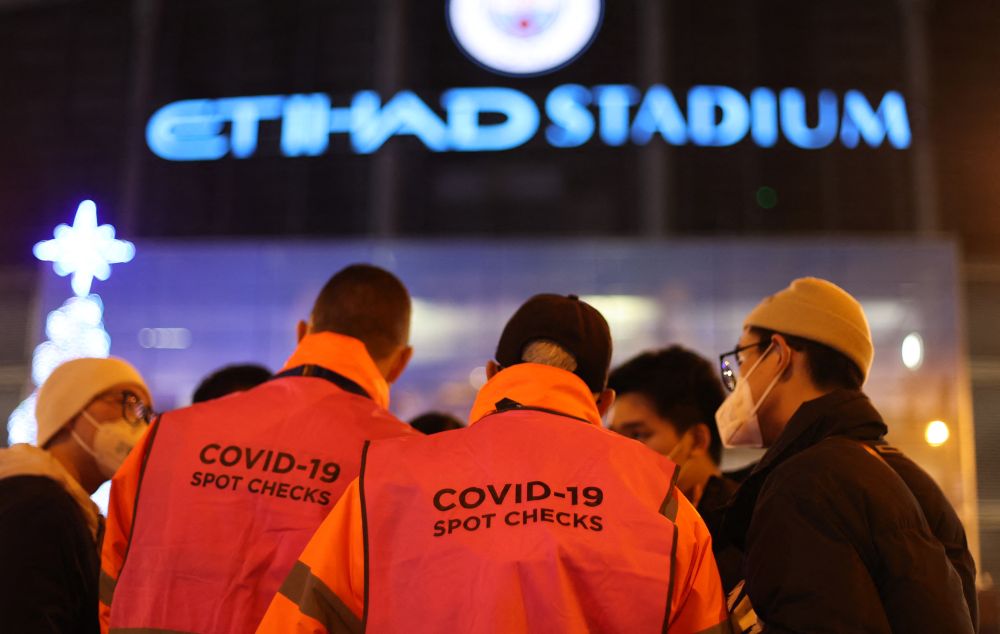 Coronavirus checks are made on fans outside the Etihad Stadium before the match between Manchester City and Leeds United in Manchester December 15, 2021. u00e2u20acu201d Reuters pic