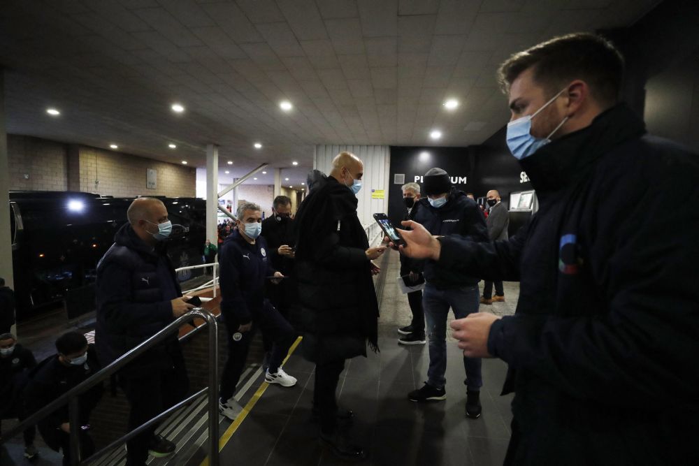 Manchester City manager Pep Guardiola has his Covid-19 pass checked outside the stadium before the match against Newcastle United at St Jamesu00e2u20acu2122 Park December 19, 2021. u00e2u20acu201d Reuters pic