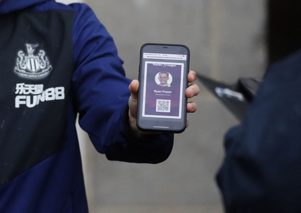 Newcastle United's Ryan Fraser holding his phone has his Covid-19 pass checked before the match against Manchester City at St Jamesu00e2u20acu2122 Park, Newcastle December 19, 2021. u00e2u20acu201d Reuters pc