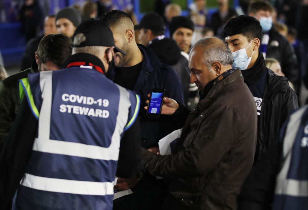 Fans get their coronavirus passes checked outside the stadium before the match between Chelsea and Everton at Stamford Bridge, London December 16, 2021. u00e2u20acu201d Reuters pic