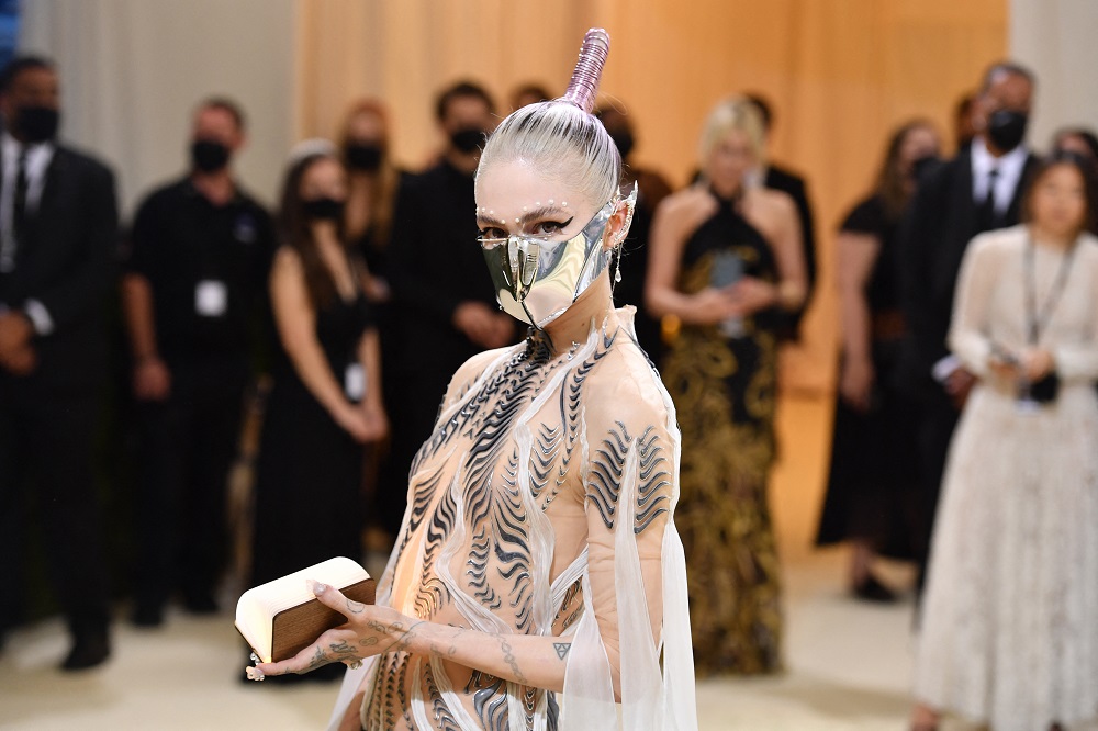 Make like Grimes and go for a futuristic space-inspired look this holiday season. u00e2u20acu2022 AFP pic