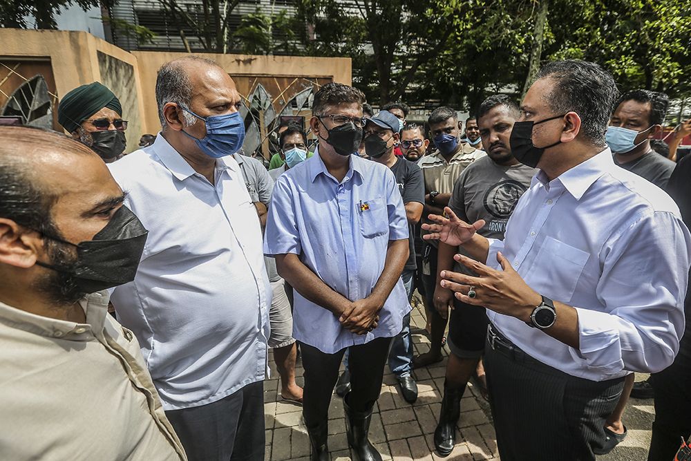 Housing and Local Goverment Minister Datuk Seri Reezal Merican Naina Merican (right) during a visit to Taman Sri Muda in flood-hit Shah Alam December 20, 2021.  u00e2u20acu201d Picture by Hari Anggara