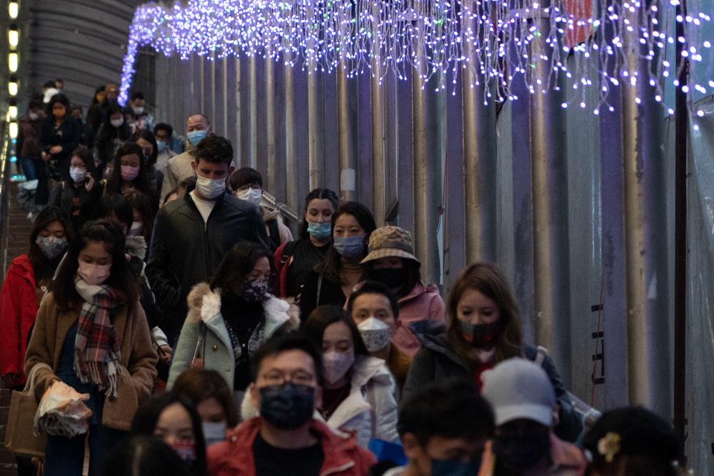 People walk past Christmas-themed lights during Boxing Day in Hong Kongu00e2u20acu2122s Central district December 26, 2021. u00e2u20acu201d AFP pic 