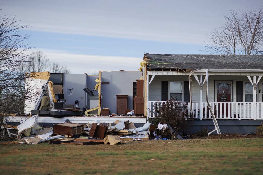 A home damaged by winds stands with some of the walls and roof missing after a tornado ripped through the area the previous evening on December 11, 2021 in Mayfield, Kentucky. u00e2u20acu201d Getty Images via AFP