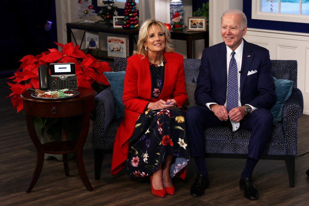 US President Joe Biden and first lady Dr. Jill Biden participate in an event to call NORAD and track the path of Santa Claus on Christmas Eve in the South Court Auditorium of the Eisenhower Executive Building on December 24, 2021 in Washington, DC. u00e2u20acu201d AF