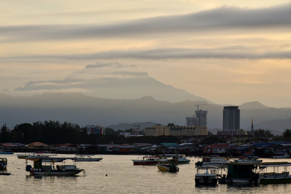 Kota Kinabalu town in Sabah at dusk, December 23, 2021. u00e2u20acu201d Bernama pic 
