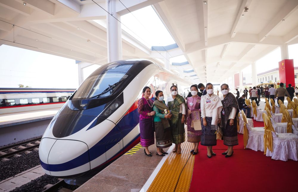 Women pose next to a train one day prior to the handover ceremony of the high-speed rail project linking the Chinese southwestern city of Kunming with Vientiane, Laos December 2, 2021. u00e2u20acu201d Reuters pic