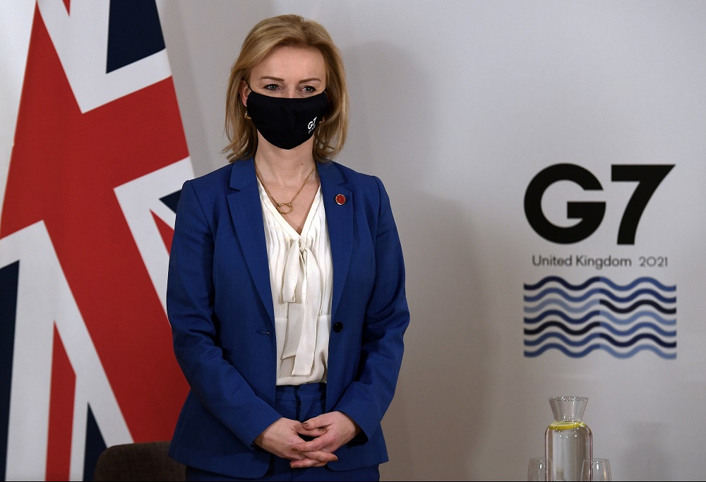 Britain's Foreign Secretary Liz Truss poses for a photograph before a bilateral meeting with US Secretary of State Antony Blinken ahead of the G7 foreign ministers summit in Liverpool, Britain December 10, 2021. u00e2u20acu2022 Olivier Douliery/Pool via Reuters