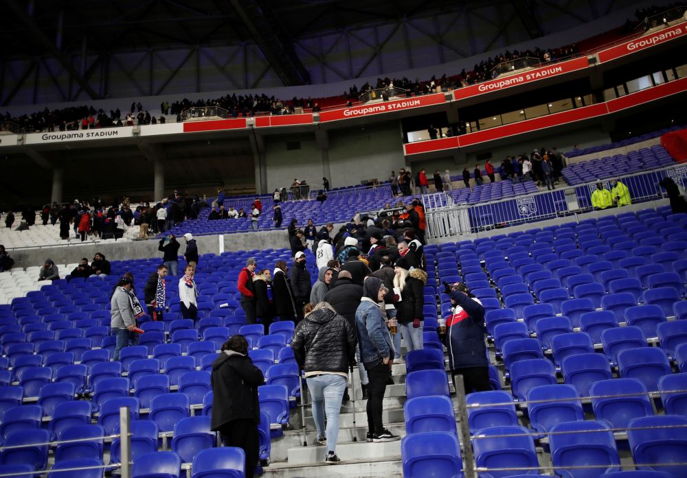 Fans leave the Groupama Stadium in Lyon after Olympique de Marseille's Dimitri Payet was hit by a water bottle thrown by a fan, causing the match to be suspended November 21, 2021. u00e2u20acu2022 Reuters pic