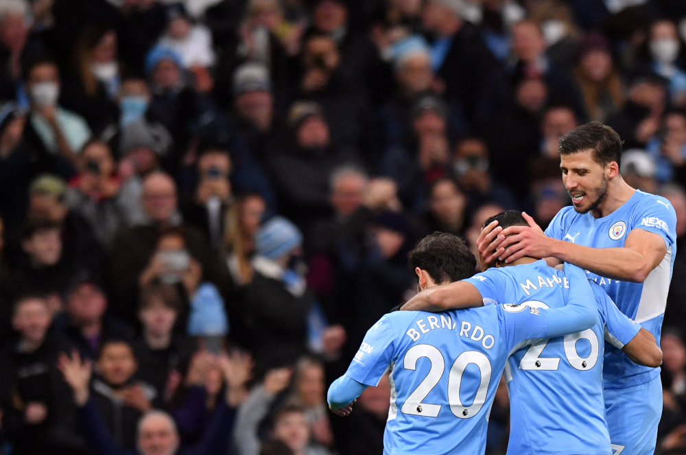 Manchester City midfielder Riyad Mahrez (centre) celebrates scoring his teamu00e2u20acu2122s second goal during the English Premier League match between against Leicester City at the Etihad Stadium in Manchester, north-west England, December 26, 2021. u00e2u20acu201d AFP pic 