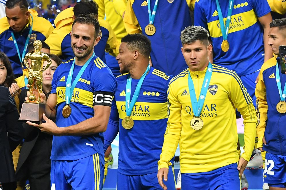 Boca Juniors Carlos Izquierdoz (left) holds the Maradona Cup trophy following a friendly with Barcelona at the Mrsool Park Stadium in Riyadh on December 14, 2021. u00e2u20acu201d AFP pic