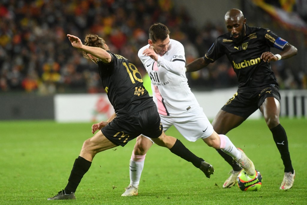 Paris Saint-Germainu00e2u20acu2122s Lionel Messi fights for the ball with Lensu00e2u20acu2122 Seko Fofana and Lensu00e2u20acu2122 Yannick Cahuzac during the French L1 match between RC Lens and Paris Saint-Germain (PSG) at Stade Bollaert-Delelis in Lens, France, December 4, 2021. u00e2u20acu201d AFP pic