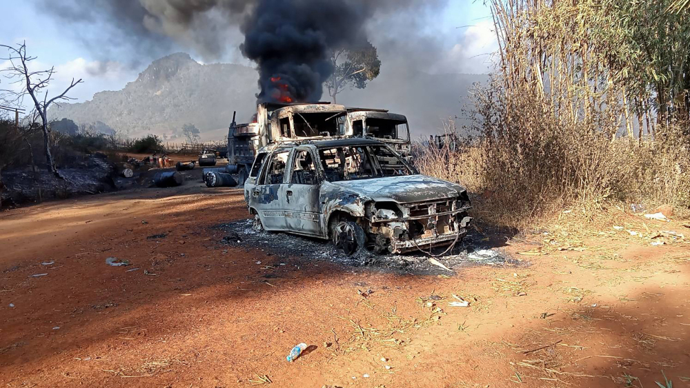 This handout image taken and released on December 25, 2021 shows burnt vehicles in Hpruso township in Kayah state. u00e2u20acu201d Karenni Nationalities Defence Force (KNDF) handout pic via AFP 