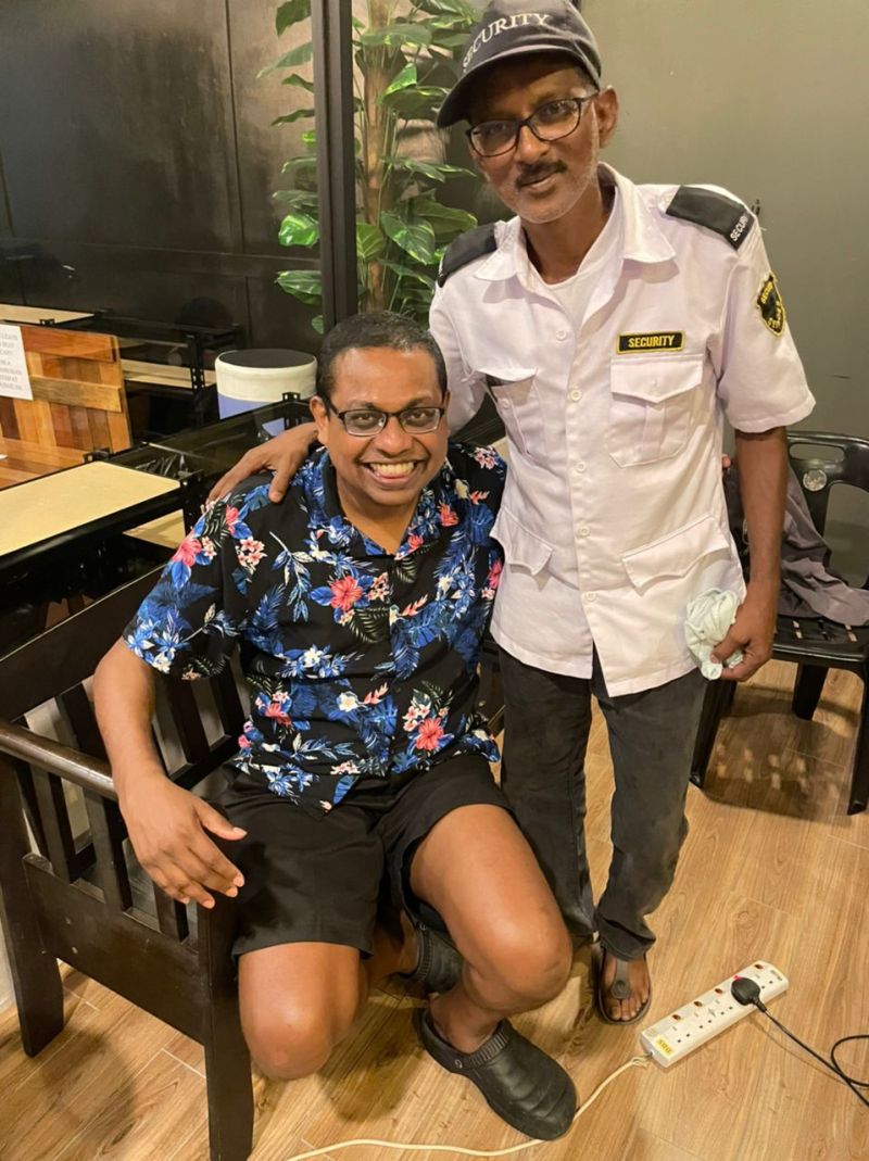 Chilling out with Selva at his guard post outside K Boutique Hotel, Teluk Intan. u00e2u20acu201d Picture by Michael Linde