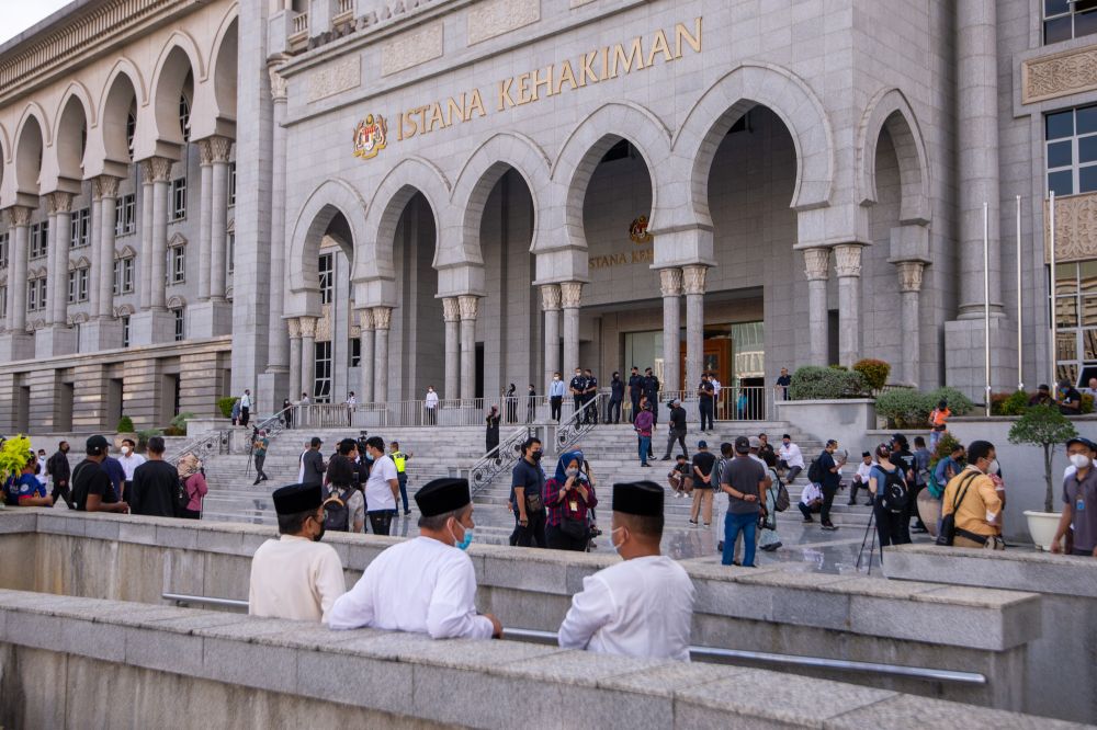 Members of media and supporters of former prime minister Datuk Seri Najib Razak are seen at the Palace of Justice in Putrajaya December 8, 2021. u00e2u20acu2022 Picture by Shafwan Zaidon