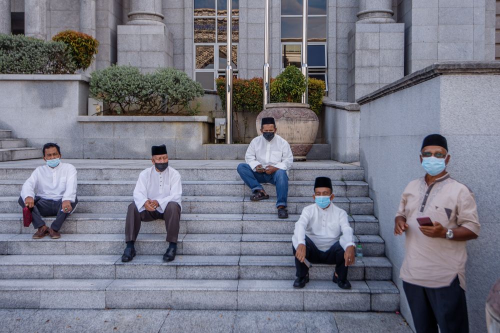 Supporters of former prime minister Datuk Seri Najib Razak are seen at the Palace of Justice in Putrajaya December 8, 2021. u00e2u20acu2022 Picture by Shafwan Zaidon