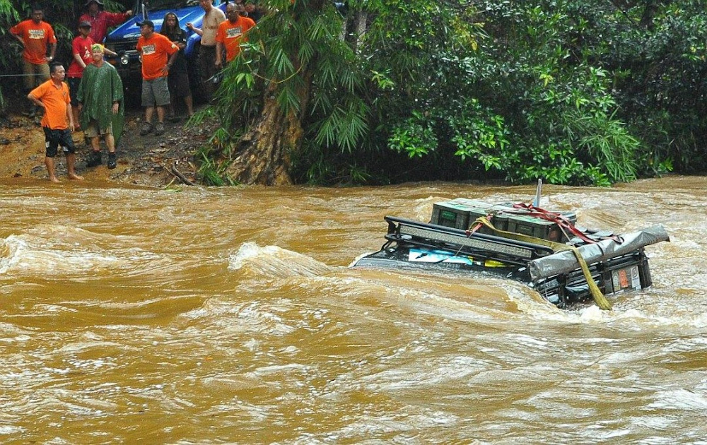 A vehicle is seen after its passengers were rescued during the flood. — Picture courtesy of Paul Si