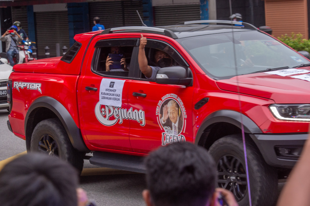 Parti Pejuang Tanah Air members convoy around the city centre with posters on cars as part of the Rakyat Tuntut Tiga protest to urge the government to control prices of goods in Kuala Lumpur, December 3, 2021. u00e2u20acu201d Picture by Shafwan Zaidon 