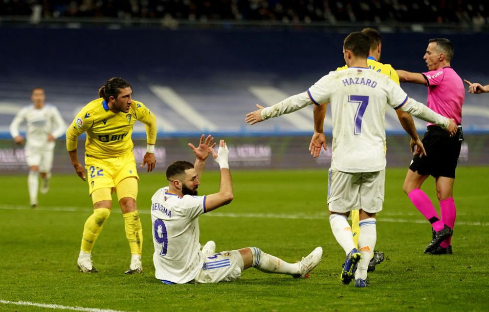 Real Madrid's Karim Benzema and Eden Hazard react during the match against Cadiz at Santiago Bernabeu, Madrid December 19, 2021. u00e2u20acu201d Reuters pic