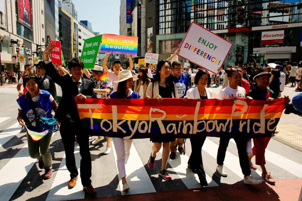 Participants hold a banner as they march during the Tokyo Rainbow Pride parade in Tokyo April 26, 2015. u00e2u20acu201d Reuters pic
