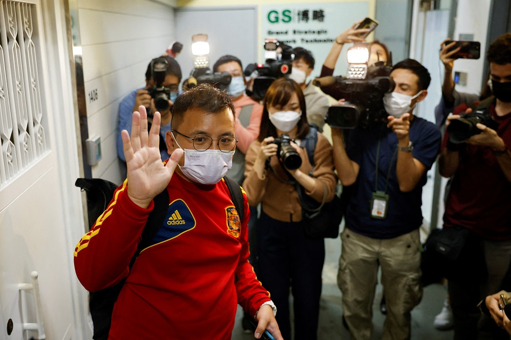 Stand News deputy assignment editor, Ronson Chan, waves to the media as he leaves the Stand News office, in Hong Kong December 29, 2021. u00e2u20acu2022 Reuters pic