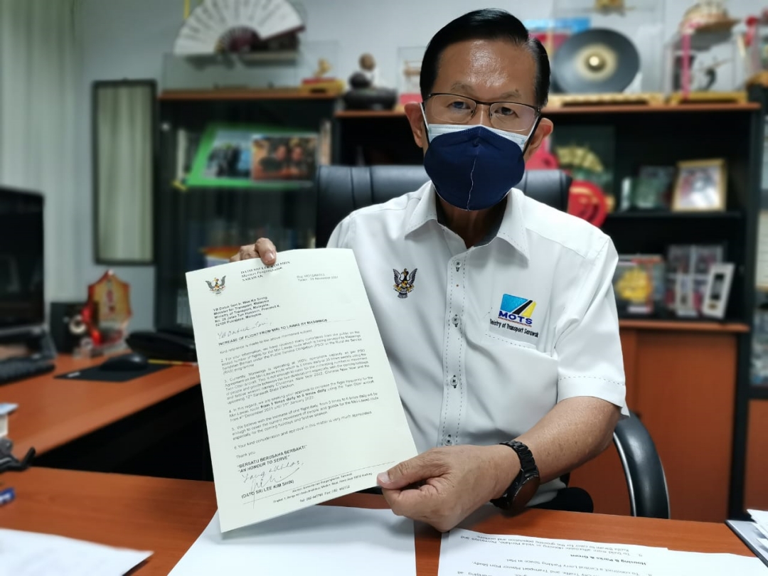 State Transport Minister Datuk Seri Lee Kim Shin showing the letter to the federal minister of transport requesting for seven more daily flights for Miri-Lawas sector. u00e2u20acu2022 Borneo Post pic