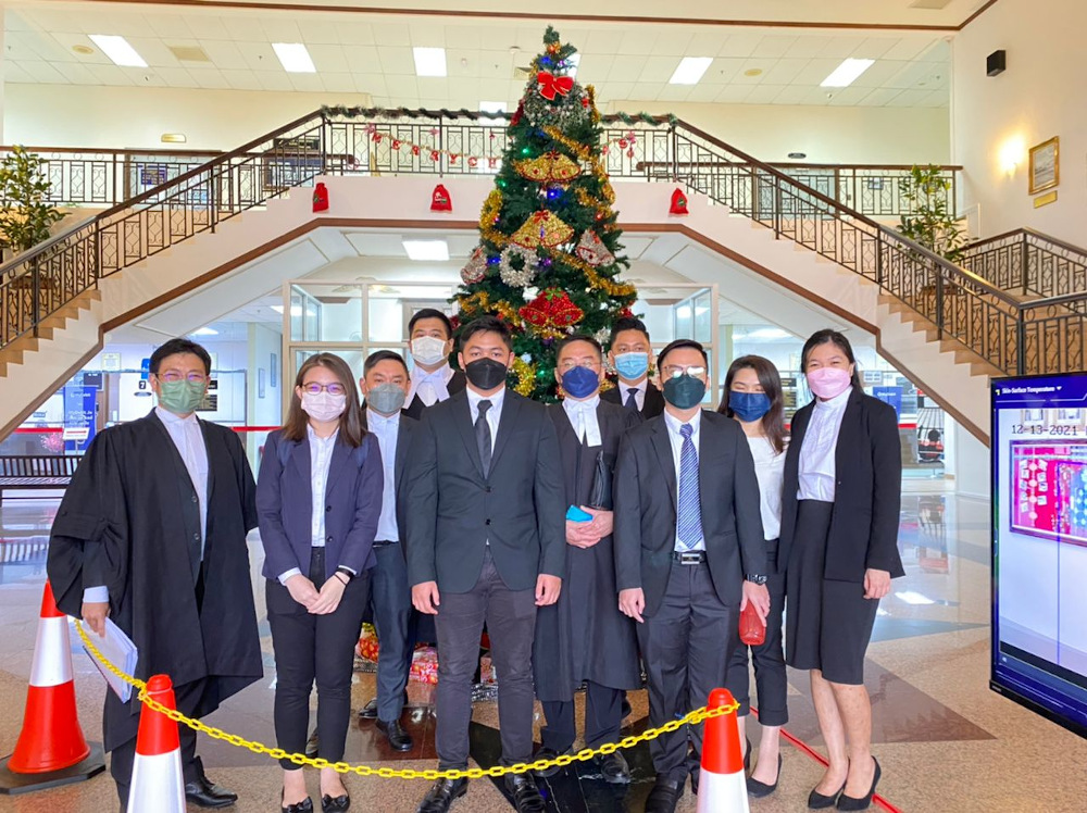 The three Sarawak youths aged 18 and 19 are seen here with their lawyers at the High Court in Kuching December 13, 2021. — Picture courtesy of Janice Then
