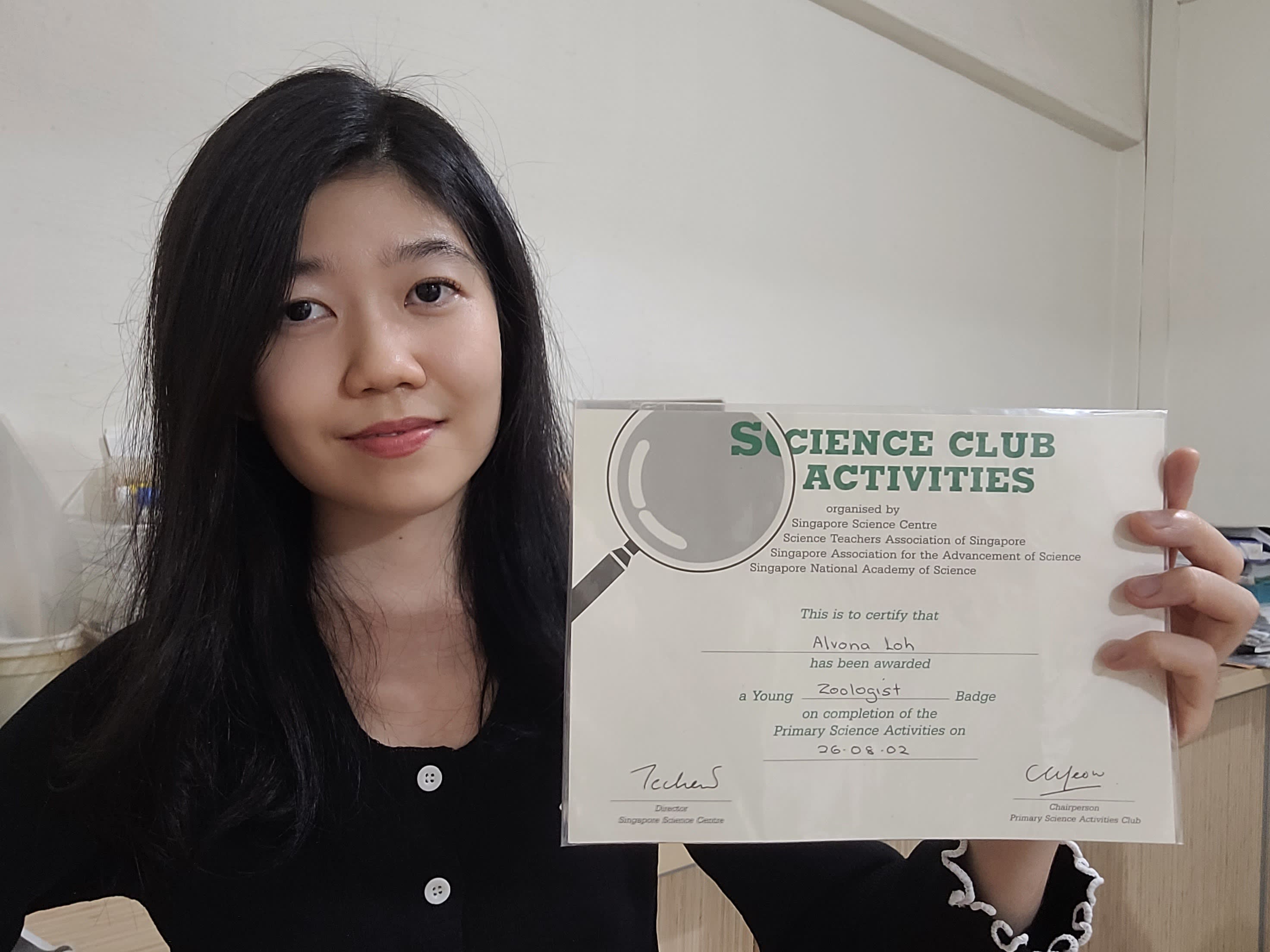 The author with a certificate of her participation in Science Centre Singapore’s Young Scientist Badge Programme in 2002. — Picture courtesy of Alvona Loh Zi Hui
