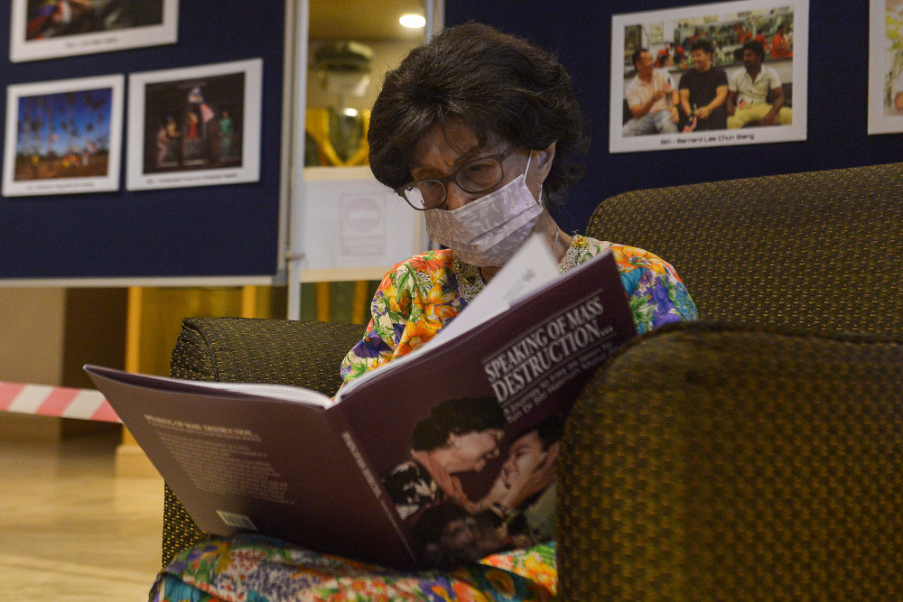 Tun Dr Siti Hasmah Mohamad Ali reading the book ‘Speaking of Mass Destruction, A journey to Iraq’ at Perdana Leadership Foundation, Putrajaya, December 3, 2021. — Picture by Miera Zulyana