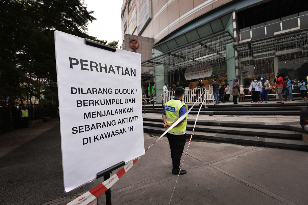 Police have cordoned off a large section of a sidewalk in front of Sogo shopping centre ahead of the Rakyat Tuntut Tiga protest December 3, 2021. u00e2u20acu201d Picture by Shafwan Zaidon