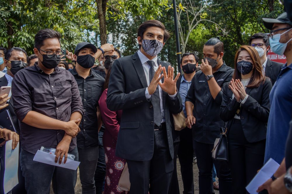 Muda president Syed Saddiq Syed Abdul Rahman addresses supporters at the Kuala Lumpur High Court December 14, 2021. — Picture by Shafwan Zaidon