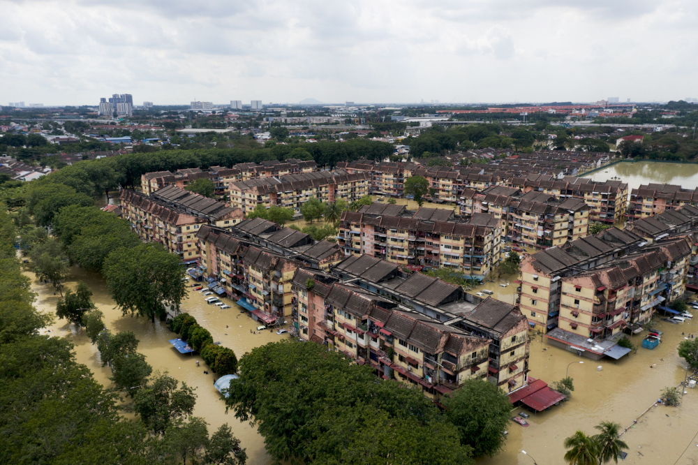 Aerial view shows inundated apartment buildings in Shah Alamu00e2u20acu2122s Taman Sri Muda neighbourhood in Selangor, December 21, 2021. u00e2u20acu201d Reuters pic 