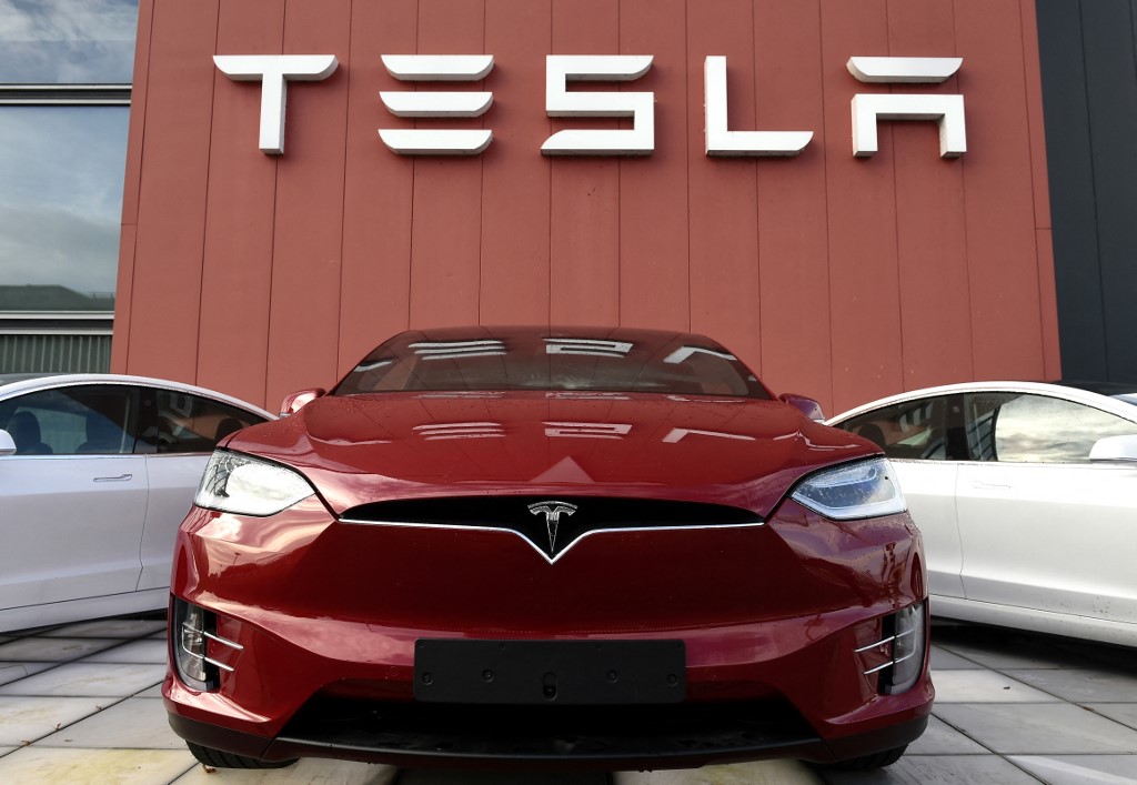 In this file photo taken on October 23, 2019 the logo marks the showroom and service centre for the US automotive and energy company Tesla in Amsterdam. u00e2u20acu201d AFP pic