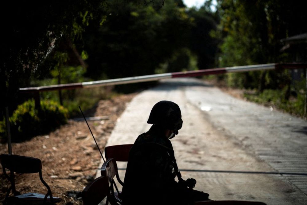 A Thai soldier sits in front of a blocked road leading to the Thailand-Myanmar border where fighting between the Myanmar army and ethnic minority rebels still continues, December 19, 2021. u00e2u20acu201d Reuters pic