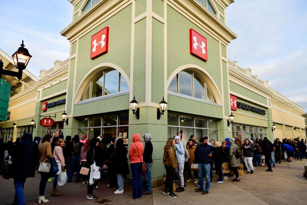Shoppers wait in line to enter stores as Black Friday sales begin at The Outlet Shoppes of the Bluegrass in Simpsonville, Kentucky, US, November 26, 2021. u00e2u20acu201d Reuters pic