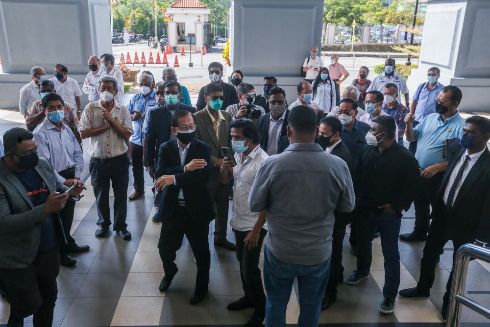 MIC and MCA members are pictured at the Kuala Lumpur High Court  December 29, 2021. u00e2u20acu201d Picture by Hari Anggara
