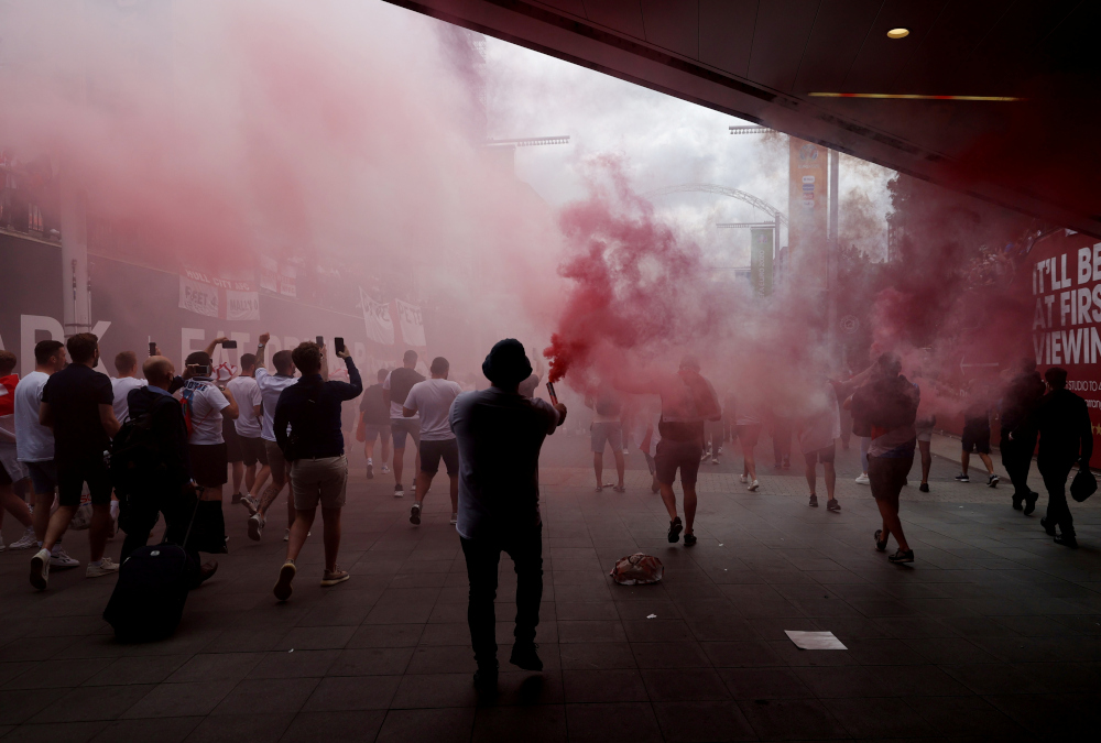 England fans with flares on Wembley way outside Wembley stadium ahead of the Italy v England match, London, July 11, 2021. u00e2u20acu201d Action Images via Reuters