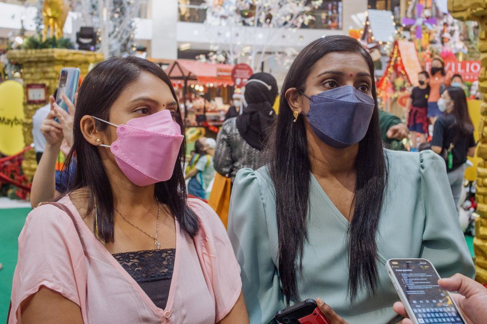 Entrepreneur Nalini Rajaendran (left) and property manager Maya Balal speak to Malay Mail at Pavilion Kuala Lumpur December 23, 2021. — Picture by Shafwan Zaidon