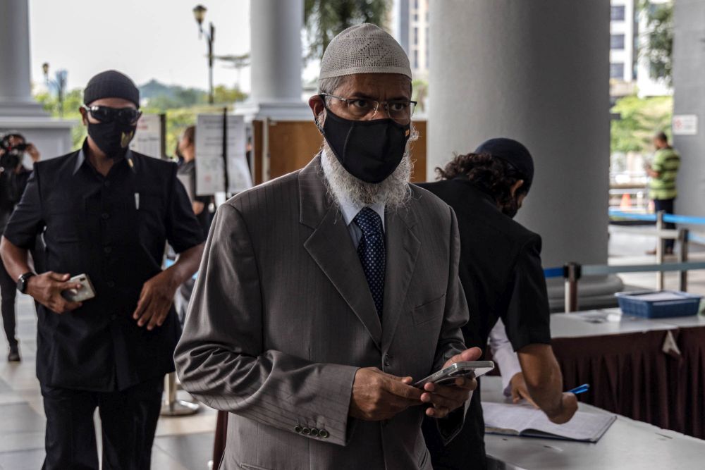 Dr Zakir Naik arrives at the Kuala Lumpur High Court December 22, 2021. u00e2u20acu201d Picture by Firdaus Latif