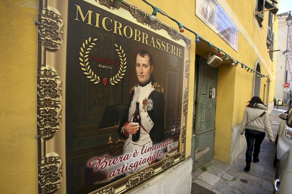 In this file photo taken on March 25, 2021 a woman walks by the Imperial beer Microbrasserie in Ajaccio, Corsica. u00e2u20acu201d AFP pic