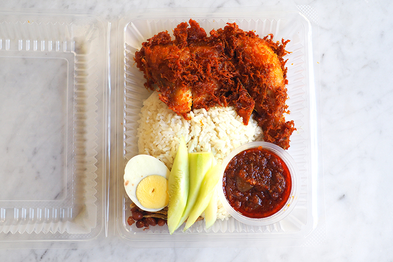 Your 'nasi lemak' is neatly packed for a takeaway meal.