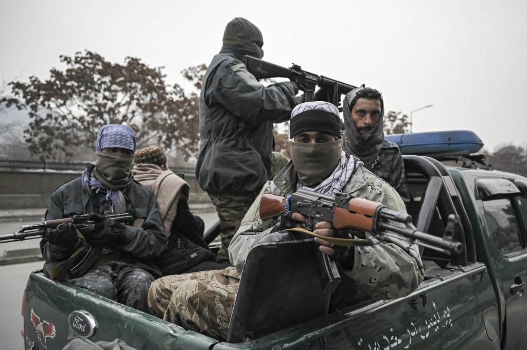 Taliban fighters patrol along a street during a demonstration by people to condemn the recent protest by the Afghan womenu00e2u20acu2122s rights activists, in Kabul on January 21, 2022. u00e2u20acu201d AFP pic