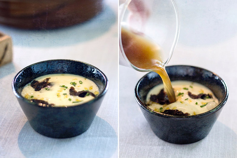 An 'amuse bouche' of truffle and shiitake consommé, poured into a bowl of potato 'espuma' with black truffle.